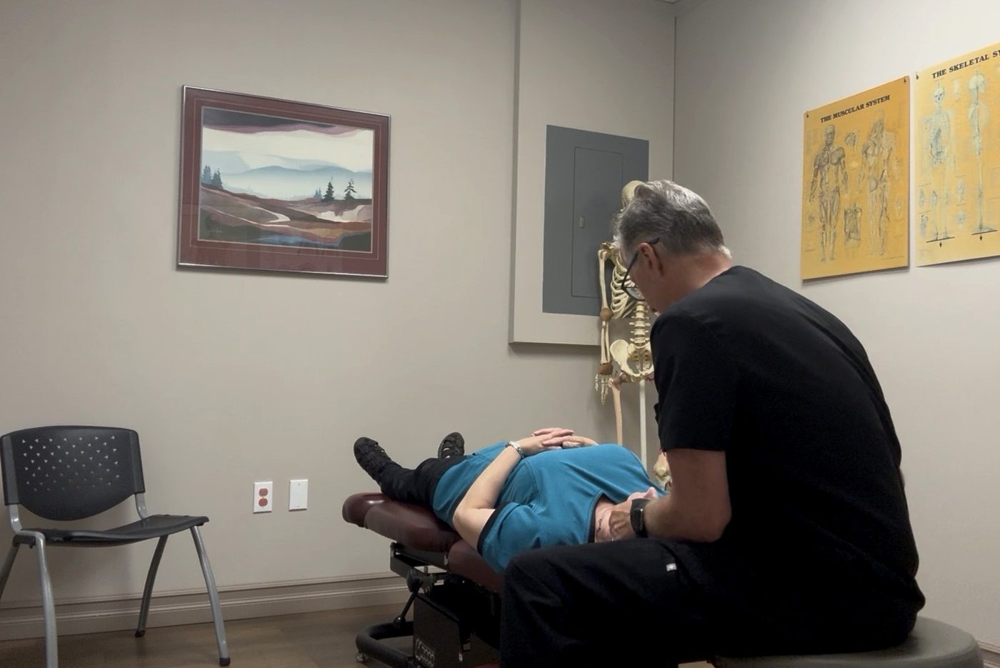 Dr. Smith performing a chiropractic adjustment at Smith Chiropractic Clinic